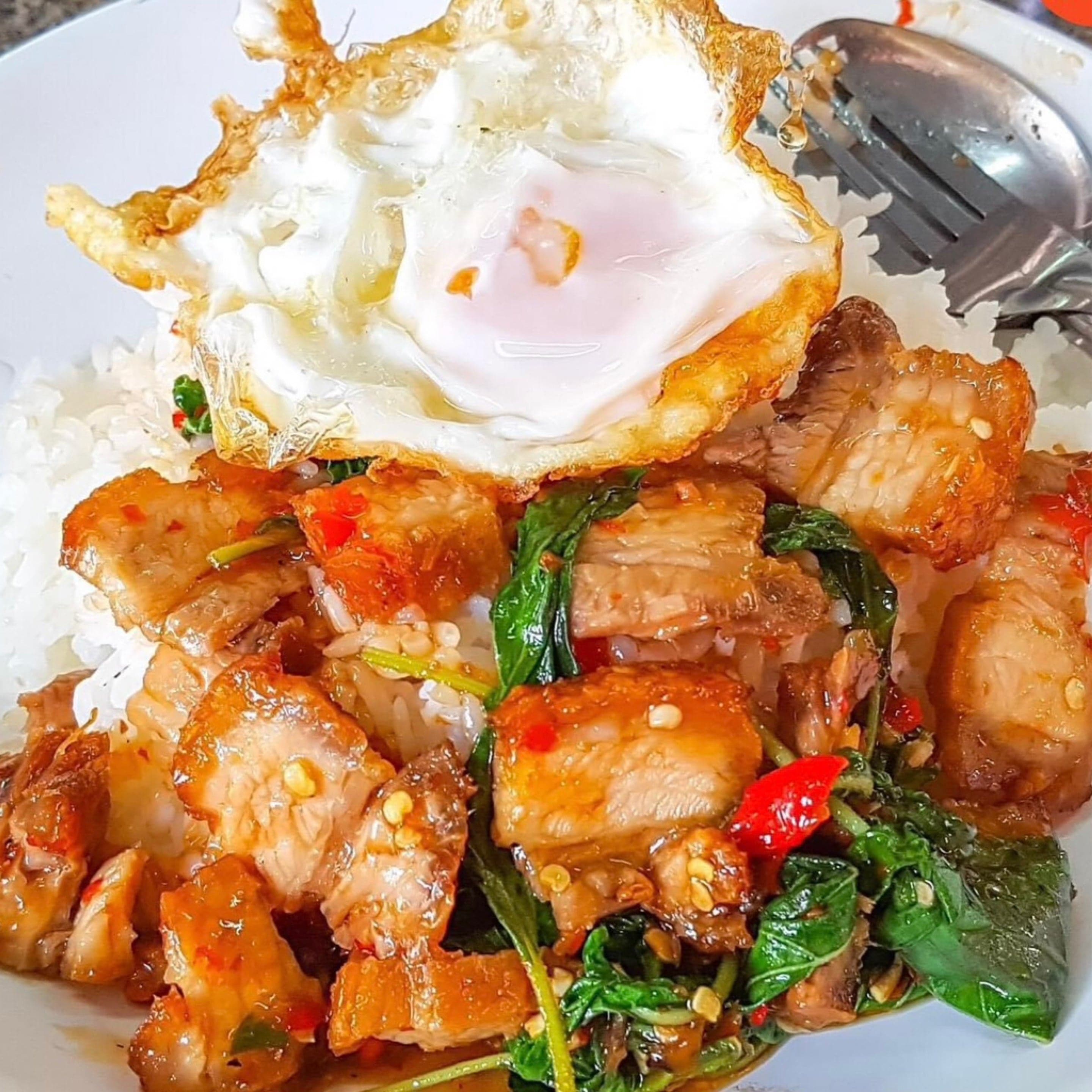 Crispy pork belly over rice
