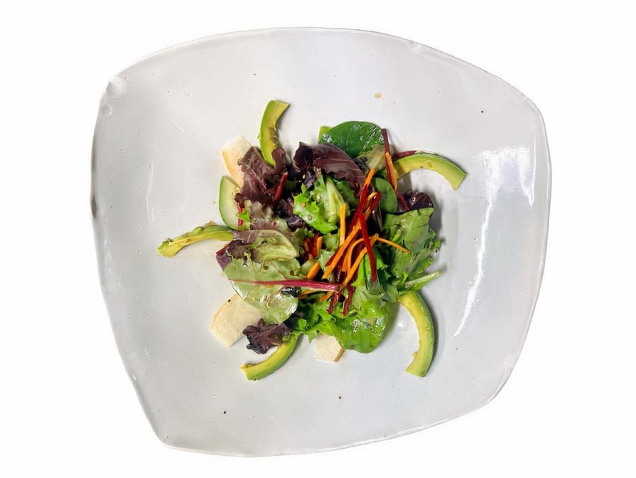 Mix green salad with avocado